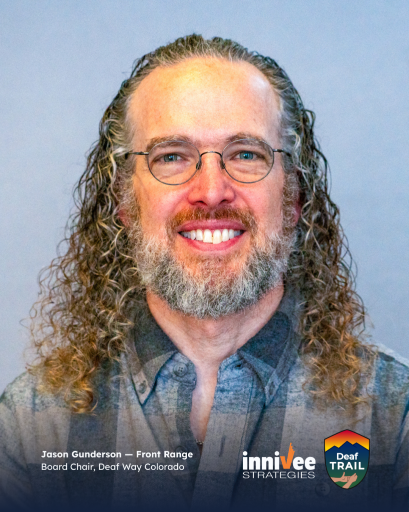 Deaf TRAIL Is Underway: Introducing Colorado’s First Cohort 15 Smiling headshot of a person with long curly hair, round glasses, and a gray beard, wearing a plaid shirt against a light blue-gray background. Name and role text appears at bottom; inniVee Strategies and Deaf TRAIL logos at bottom right.